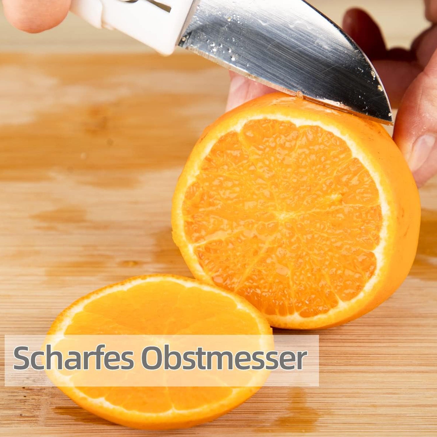 Superior eMart 2-in-1 knife and peeler slicing a fresh orange on wooden cutting board