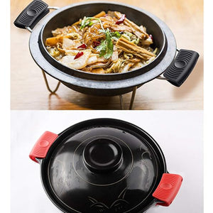 Silicone pot handle cover set in black and red on pots to protect hands from heat while cooking