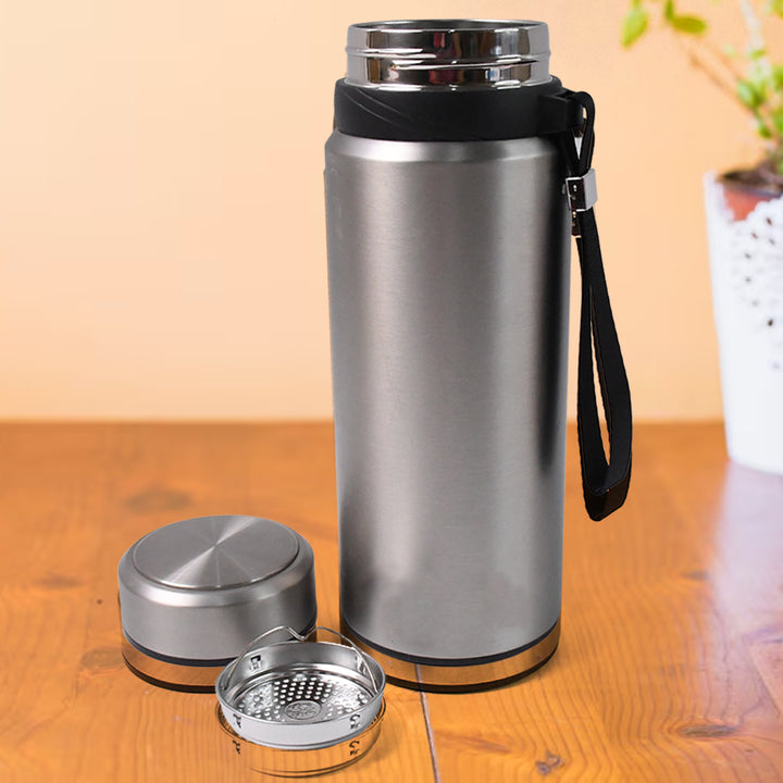 Superior eMart stainless steel insulated water bottle with detachable lid and built-in infuser on wooden surface