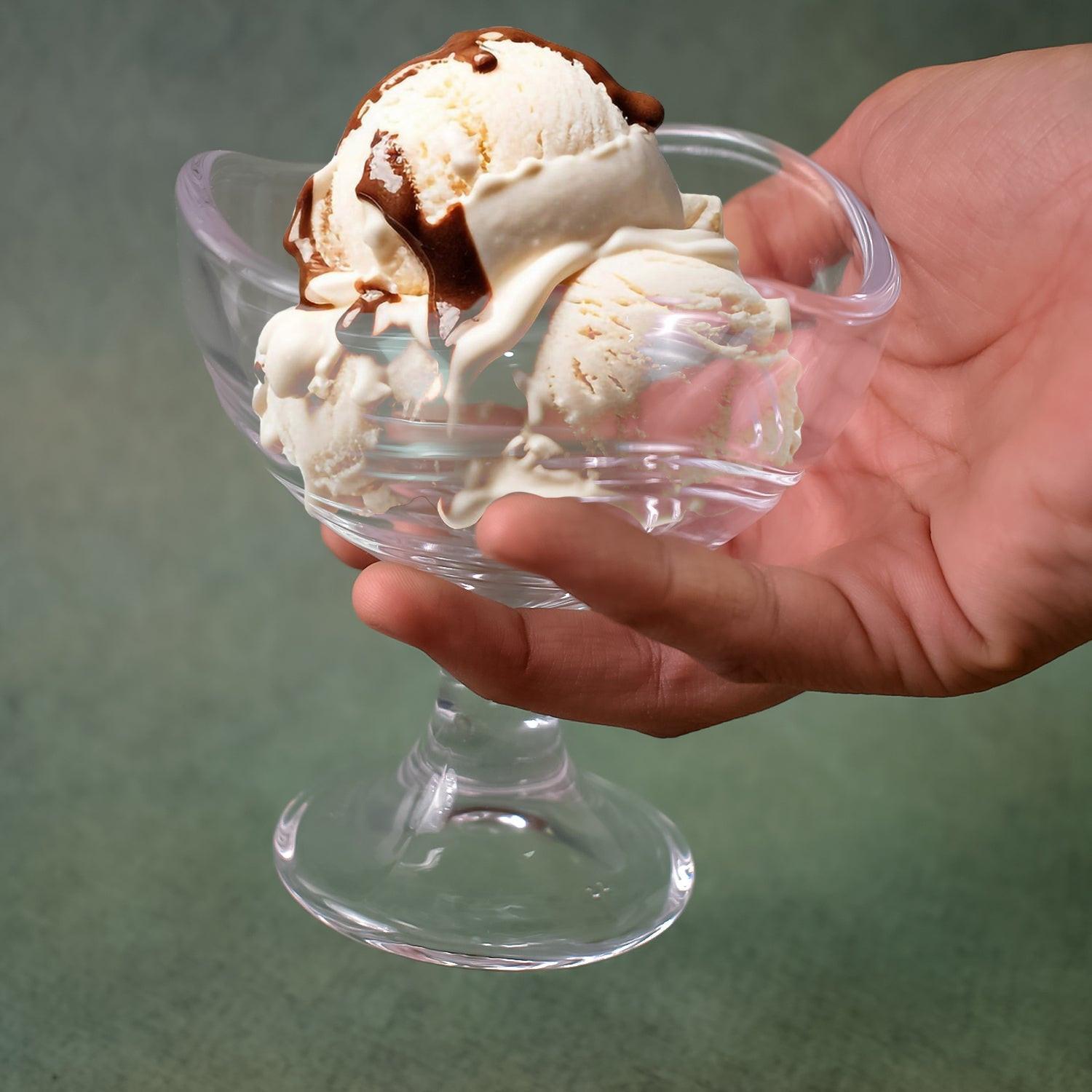 Stylish glass footed dessert bowl set showcasing ice cream with chocolate drizzle