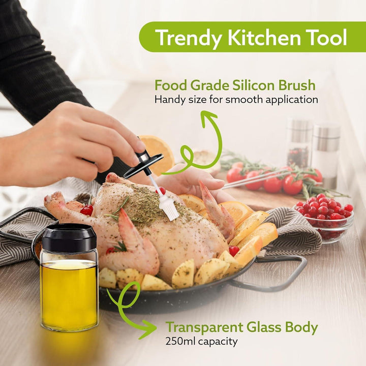 Glass oil dispenser with brush featuring a transparent body and food-grade silicone brush for precise application