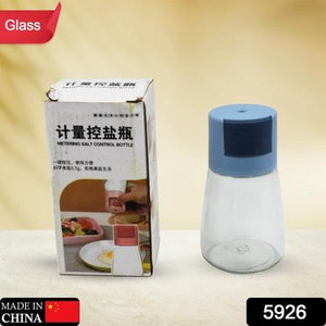 Glass salt dispenser for cooking with blue lid and measuring cap for precise seasoning