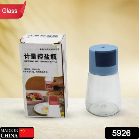 Glass salt dispenser for cooking with blue lid and measuring cap for precise seasoning