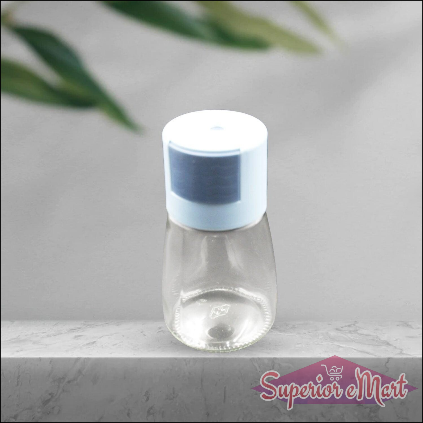 Glass salt dispenser for cooking with a blue lid, perfect for adding seasoning to dishes
