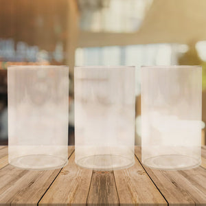Set of three unbreakable glass set for everyday use on a wooden table in a bright setting