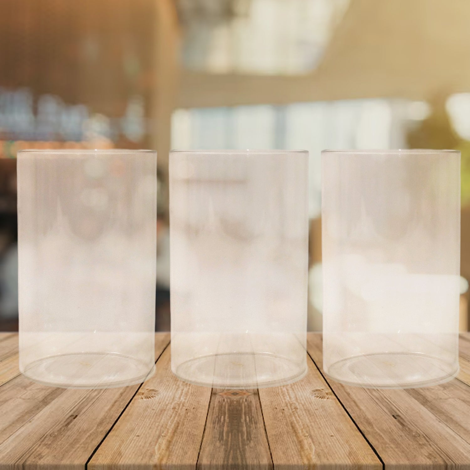 Set of three unbreakable glass set for everyday use on a wooden table in a bright setting