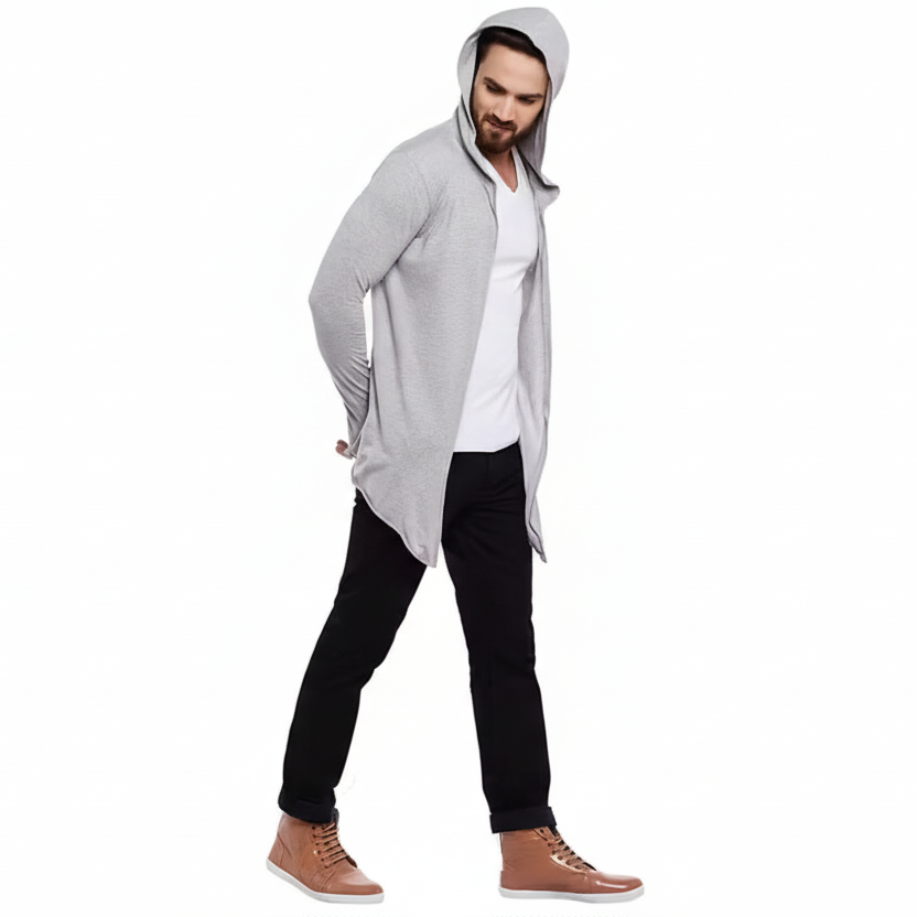 Man wearing a gray hooded jacket over a white shirt on a white background