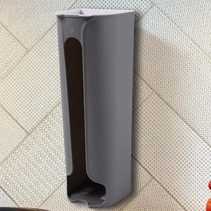 Gray bathroom trash bag organizer mounted on wall with easy bag dispensing design