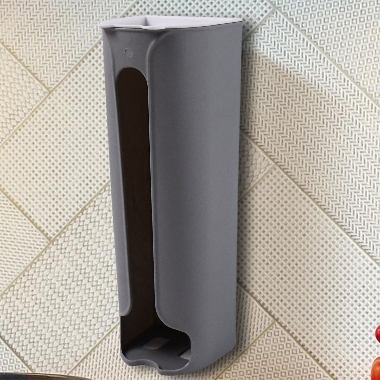 Gray bathroom trash bag organizer mounted on wall with easy bag dispensing design