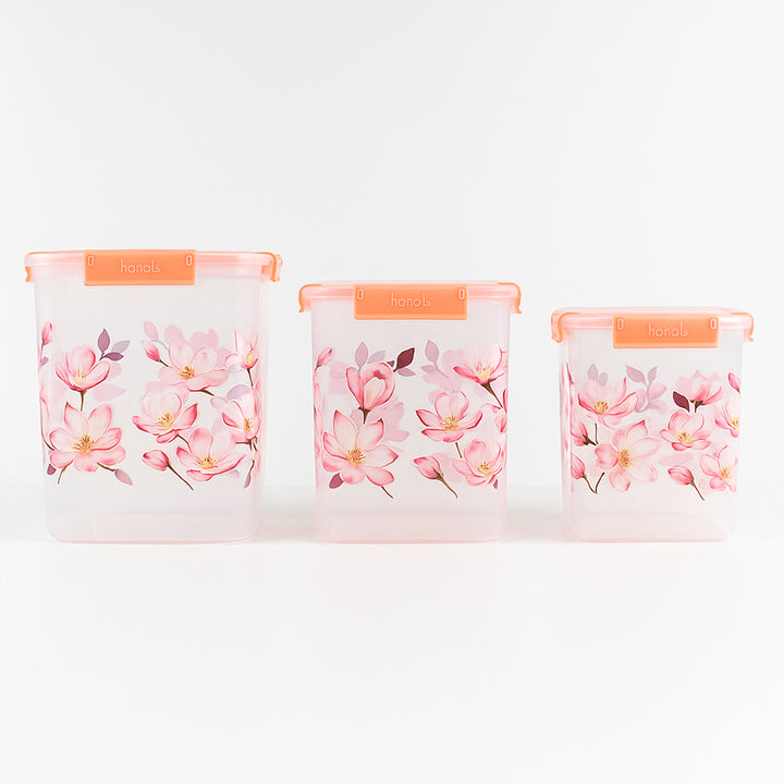 Set of three Superior eMart floral airtight storage containers with pink flower designs and orange lids