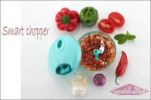 Handheld vegetable chopper with chopped vegetables and fresh herbs for easy meal preparation