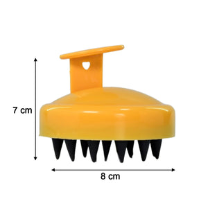 Handheld scalp massager in yellow with soft bristles for soothing baby scalp care