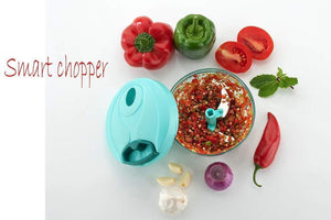 Handheld vegetable chopper with chopped vegetables and fresh herbs for easy meal preparation