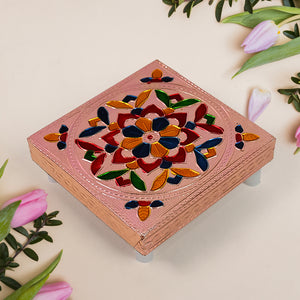 Handicraft puja table with colorful floral design and intricate detailing for home decor