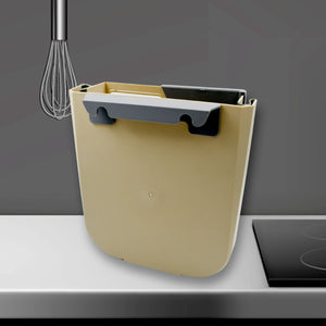 Hanging trash can for kitchen cabinet in cream color with a sleek design, ideal for space-saving