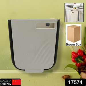 Hanging trash can for kitchen cabinet in gray color, perfect for space-saving waste management.