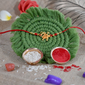 Hanumaan Ji Holding Dronagiri Mountain Rakhi with red thread and decorative green base from Superior eMart