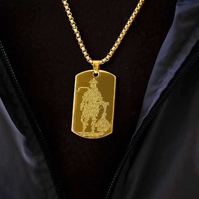 Gold Hanuman Chalisha pendant on a chain showcasing intricate design and spiritual significance