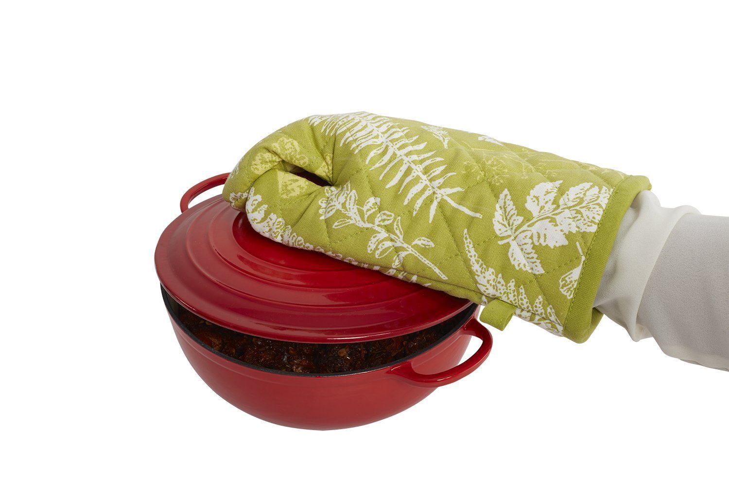Heat proof oven glove in green with floral pattern, safely handling a red cooking pot