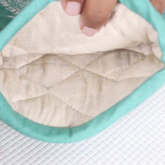 Interior view of a heat proof oven glove showcasing its quilted lining for added protection and comfort
