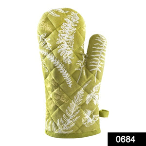 Stylish heat proof oven glove in green with fern pattern for safe handling of hot cookware