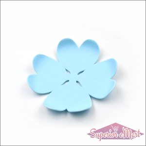 Flower-shaped blue silicone heat resistant coasters set for protecting surfaces