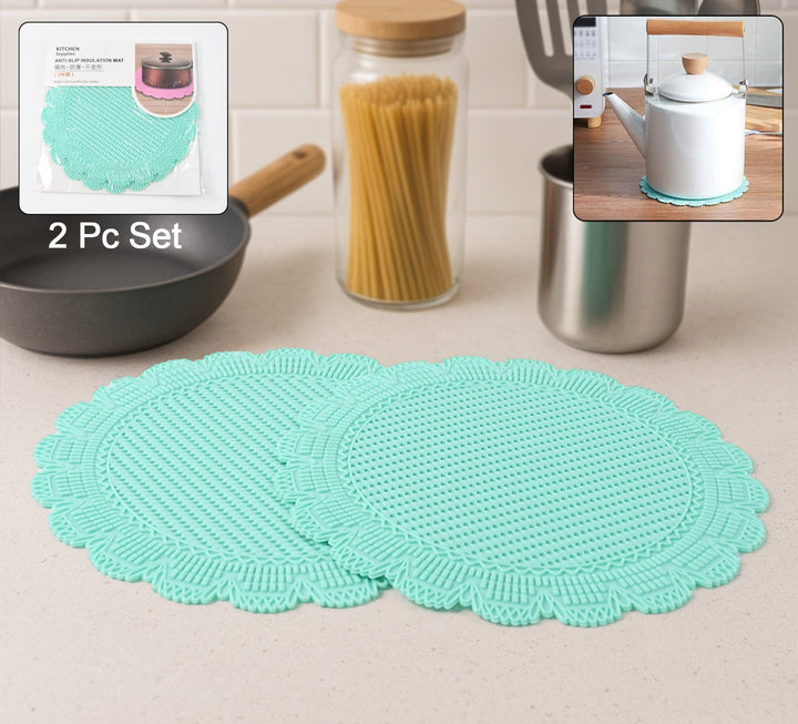 Set of two turquoise heat resistant silicone mats perfect for kitchen use and protecting surfaces