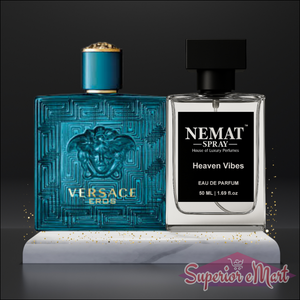 Versace Eros teal glass bottle and Nemat Heaven Vibes clear spray on a white marble stand with gold glitter.