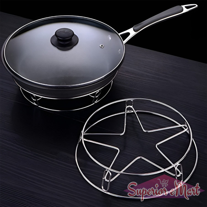 Heavy duty stainless steel gas stove stand with a black frying pan and glass lid on a dark surface
