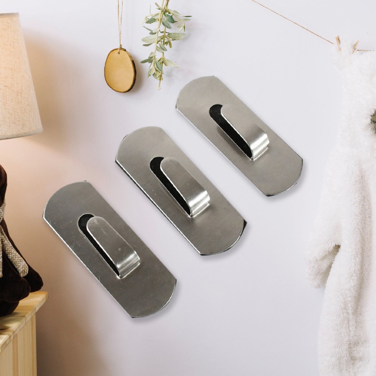 Set of three heavy duty wall hooks designed for durable and stylish home organization