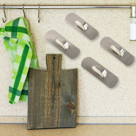 Superior eMart heavy duty wall hooks mounted on a wall, holding a green towel and displayed with a cutting board
