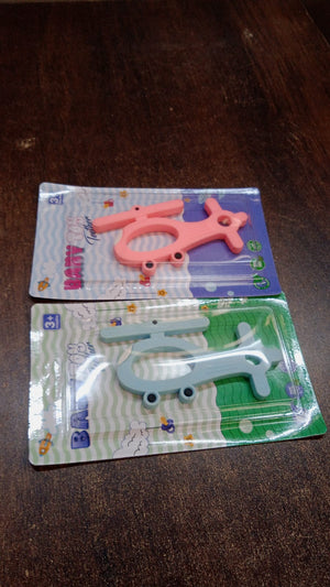 Helicopter shape teether set in pink and blue for soothing baby's gums during teething
