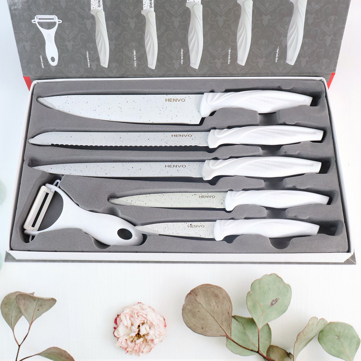 Marble coated kitchen knife set with ergonomic handles and a vegetable peeler in sleek storage box