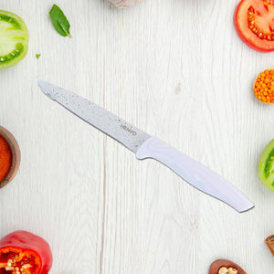 Marble coated kitchen knife set displayed among fresh vegetables for culinary preparation