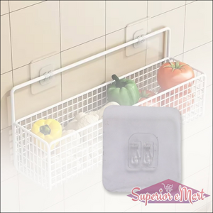 Self adhesive wall hooks holding a wire basket filled with vegetables for convenient kitchen storage