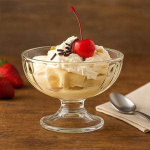 Elegant glass ice cream dessert bowl set featuring a delicious sundae topped with whipped cream and a cherry