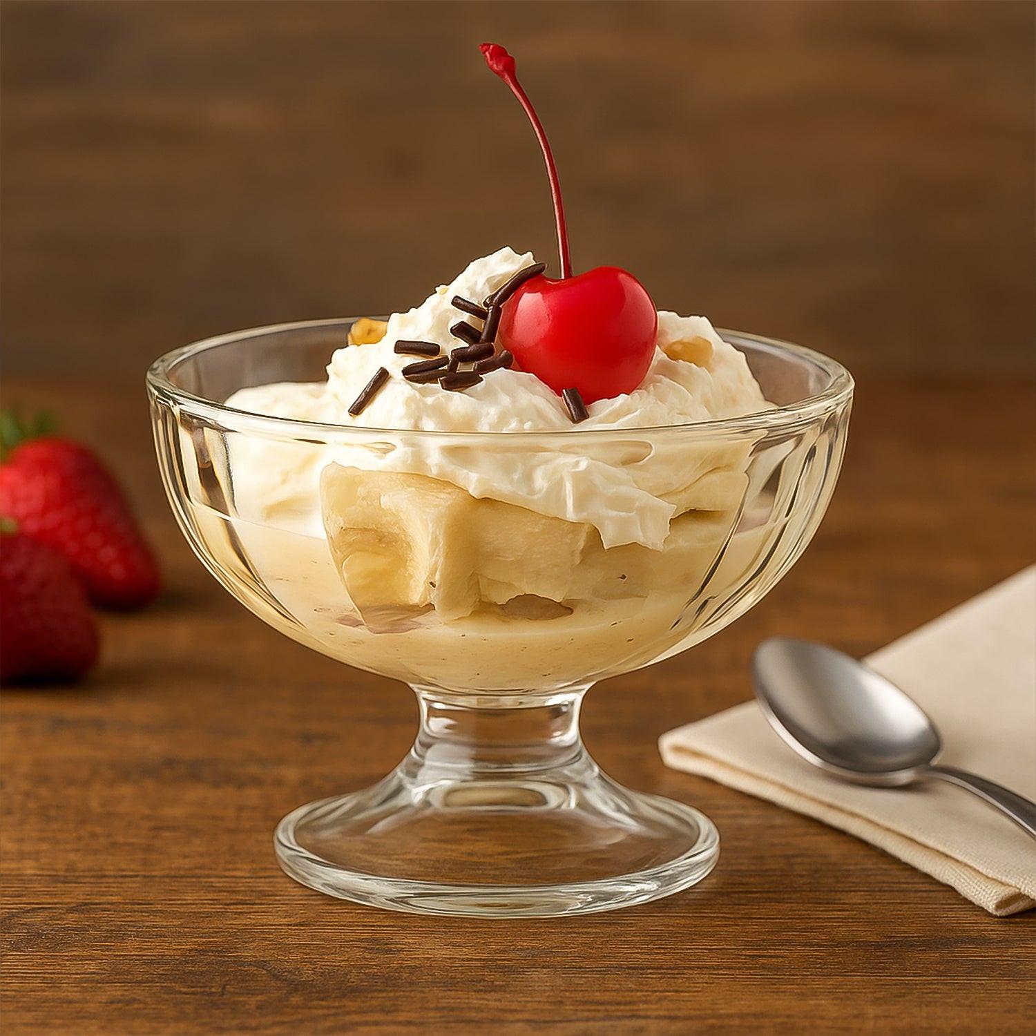 Elegant glass ice cream dessert bowl set featuring a delicious sundae topped with whipped cream and a cherry