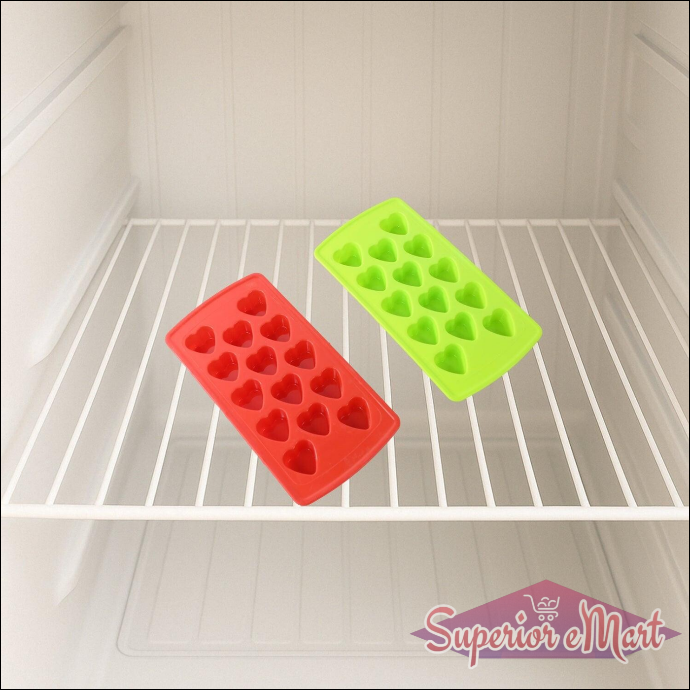 Colorful ice cube tray set in red and green heart shapes placed in a freezer