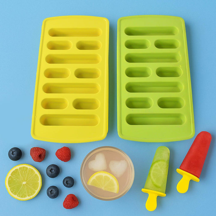Bright yellow and green ice cube tray set with fruits and colorful popsicles on a blue background
