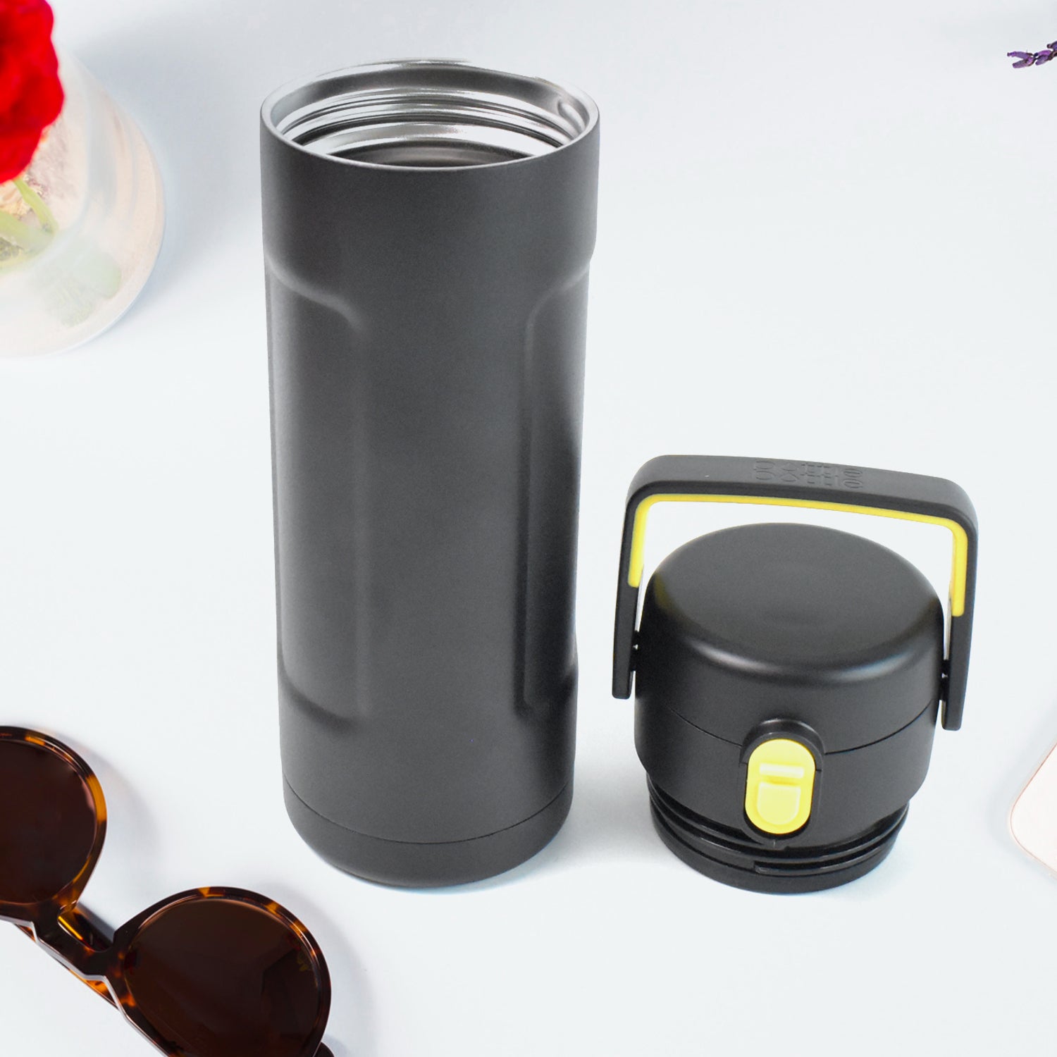 Superior eMart black insulated water bottle with yellow-accented cap and stainless steel interior