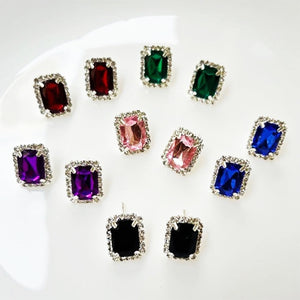 Set of interchangeable diamond earrings in various colors, perfect for versatile styling options