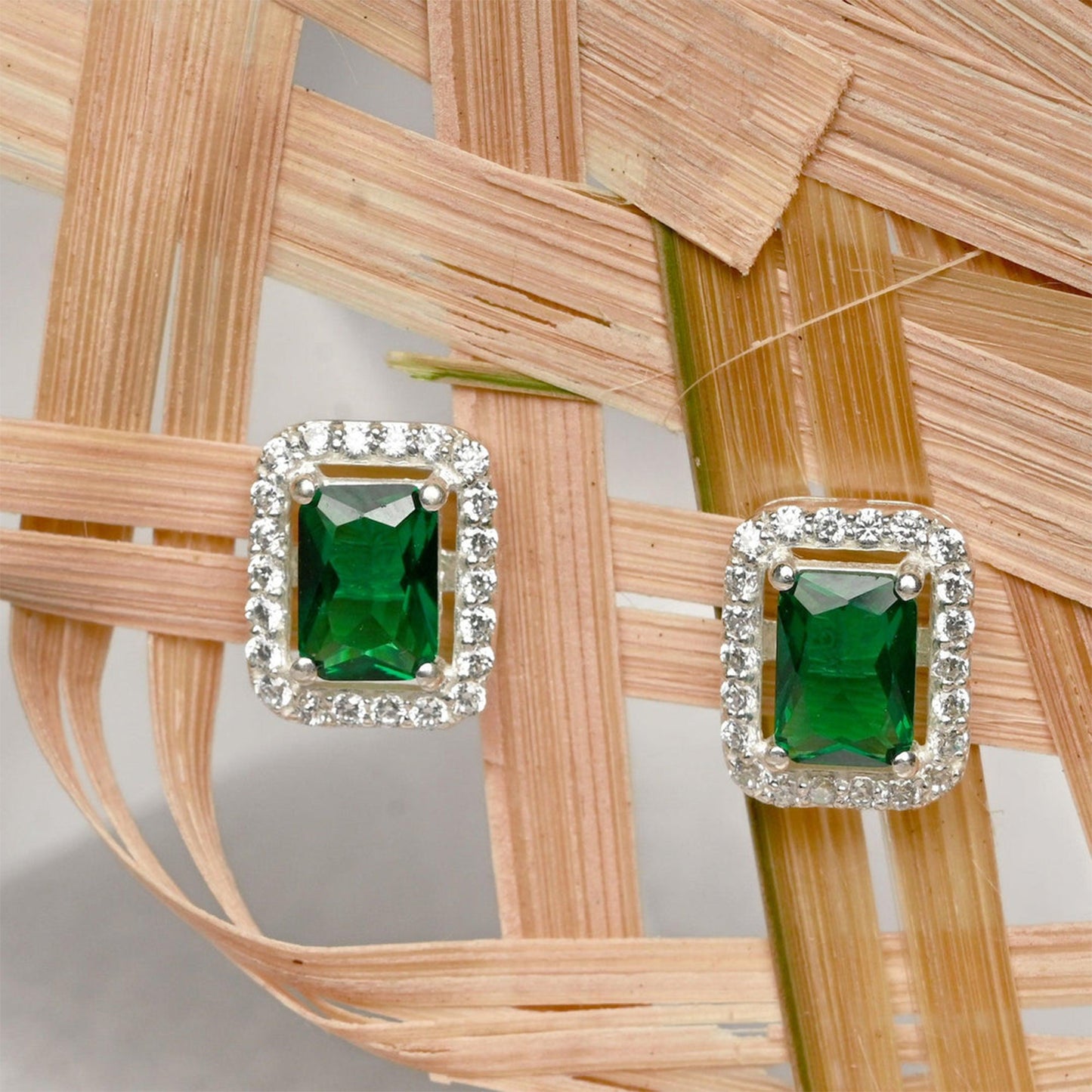 Elegant green gemstone earrings with diamond accents, perfect for pairing with interchangeable diamond earrings