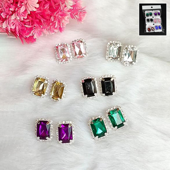 Set of colorful interchangeable diamond earrings in various shapes and colors with elegant silver settings