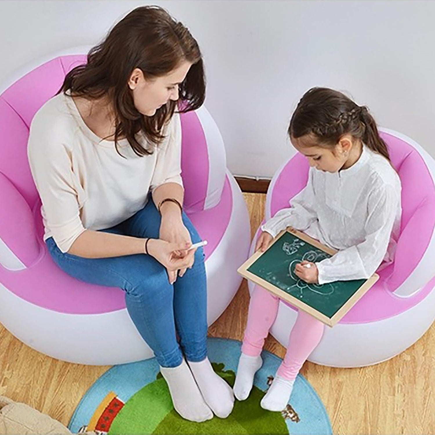 Kids inflatable sofa chair in pink and white, perfect for playtime and relaxation