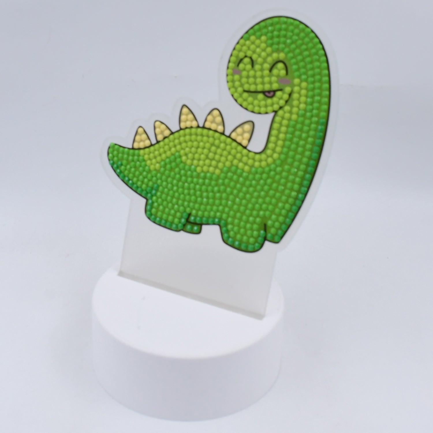 Kids night light dinosaur in green, perfect for children's bedrooms and creating a cozy atmosphere