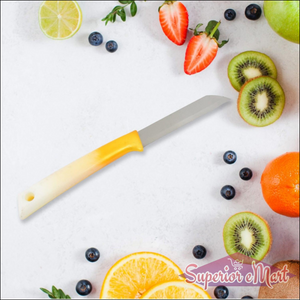 Superior eMart stainless steel kitchen knife on a countertop surrounded by fresh fruits
