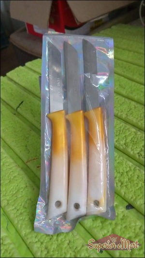 Set of three stainless steel kitchen knives with durable handles in orange and white colors
