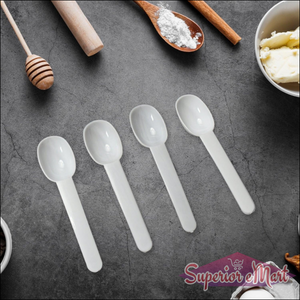 Set of four transparent measuring spoons for precise ingredients in airtight kitchen storage container