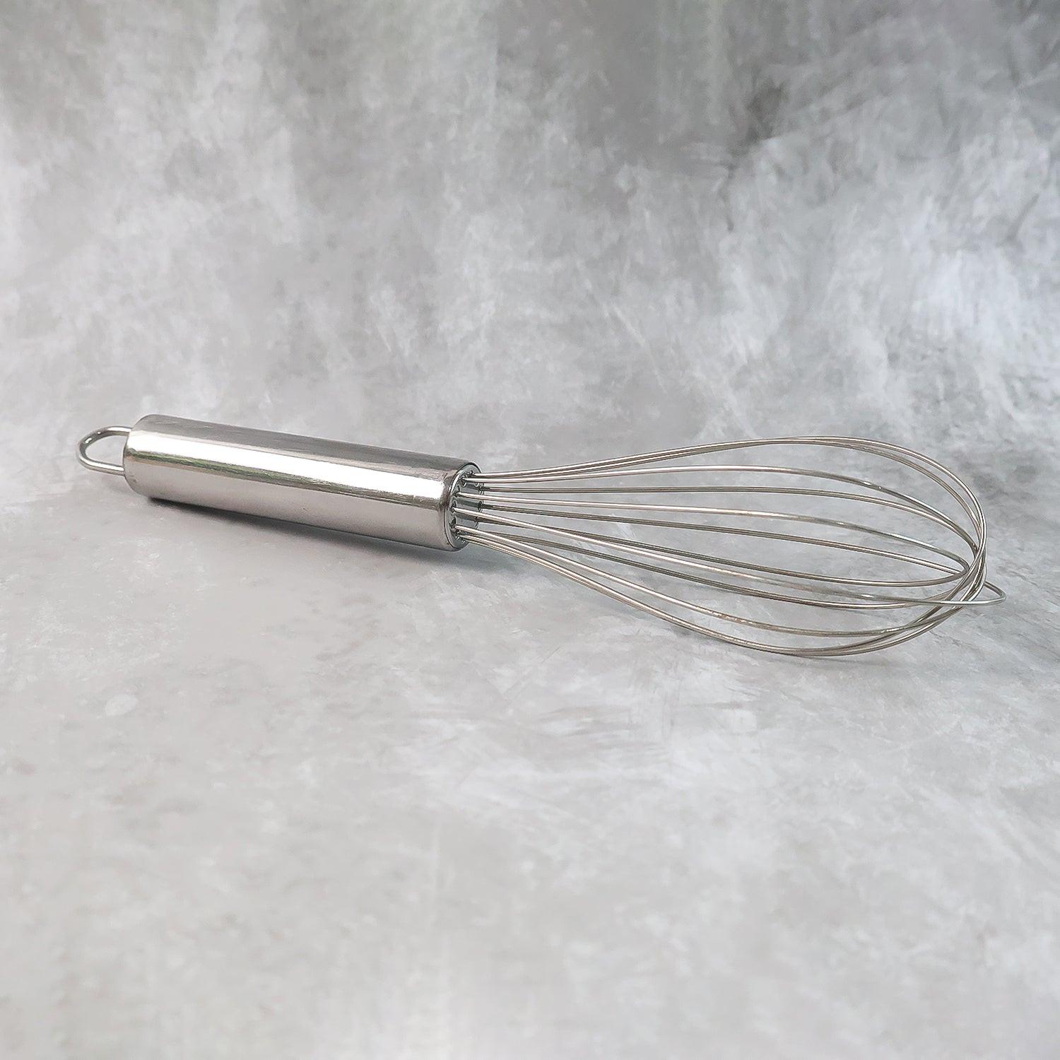 Small stainless steel balloon whisk with a sturdy handle for effortless mixing and whisking in the kitchen
