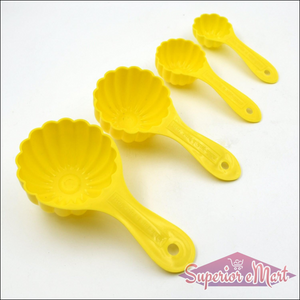 Ladoo mould spoon set in yellow, featuring four sizes for easy dessert preparation